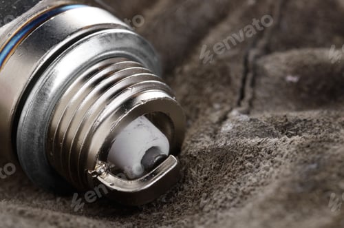 Preview: Closeup photo of new spark plug for internal combustion engine o