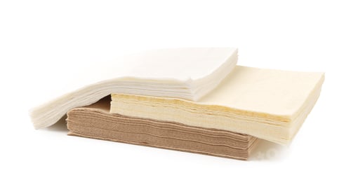 Preview: Beige paper napkins on white background studio shot