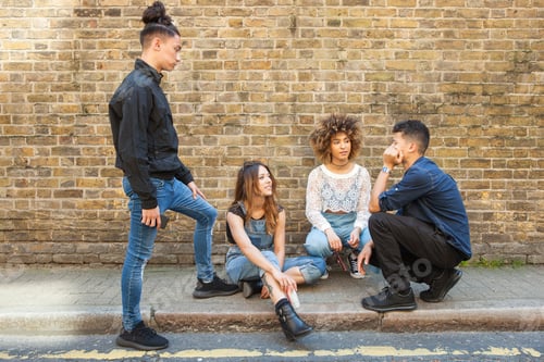 Preview: Four friends hanging out in street, talking