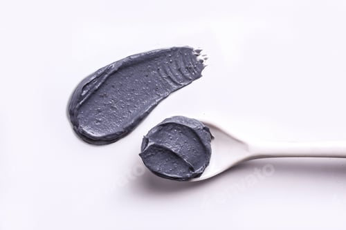 Preview: Charcoal clay texture swatch with spoon on white background