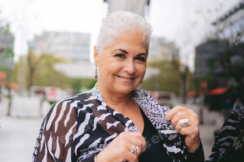 Preview: Smiling Woman with Short White Hair in City