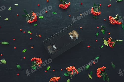Preview: Flat lay VHS video cassette on dark background