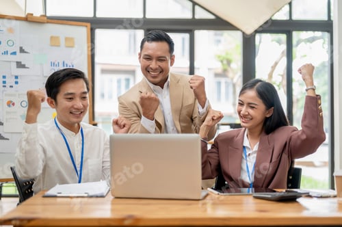 Preview: A group of cheerful Asian businesspeople are rejoicing in their project success together.