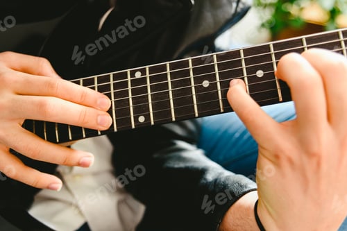 Preview: Placing the fingers on a guitar to play some notes by a professional guitarist.