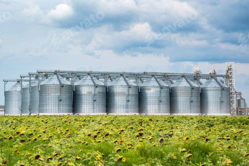 Preview: Distant view of sunflower oil refinery in a field
