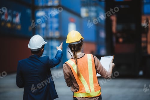 Workers Inspecting Shipping Containers in a Shipping Yard