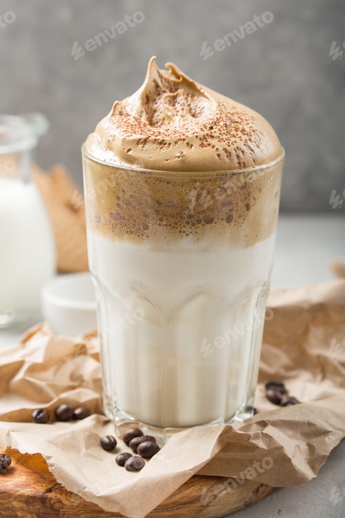 Preview: Dalgona creamy coffee in a glass on a light gray background with whipped foam. Korean food trend
