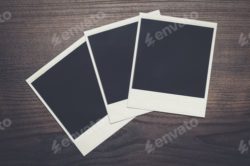 Preview: some old photos on brown wooden table background