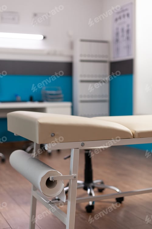 Preview: Selective focus on medical bed in empty hospital office with nobody in it