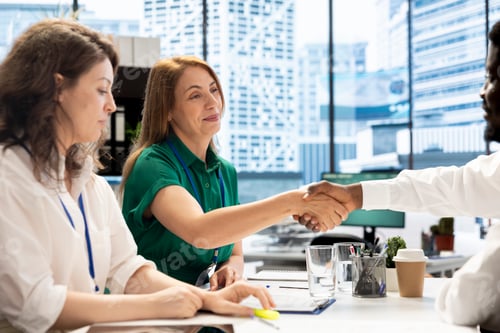 Preview: Happy management board doing meeting, doing welcoming handshake