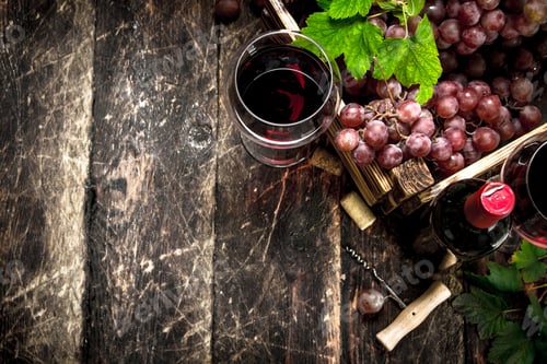 Preview: Wine background. Red wine with a box of grapes.