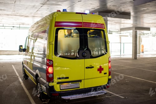 Preview: Ambulance car with brigade of paramedics inside moving out of parking station