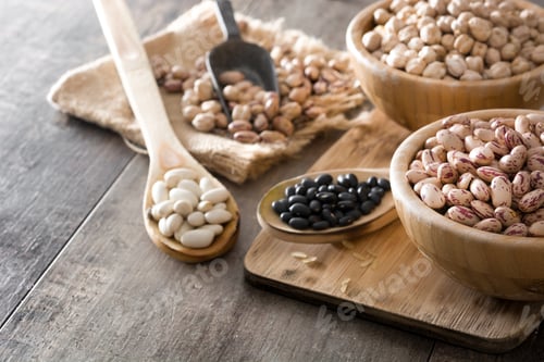 Preview: Various legumes displayed on rustic wooden table: promoting healthy diet