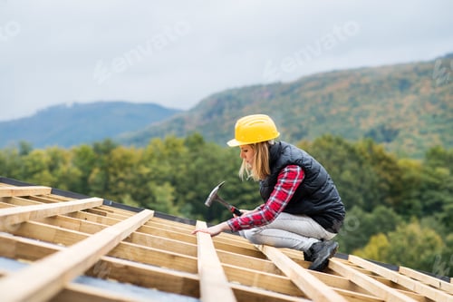 Preview: Young woman worker on the construction site.