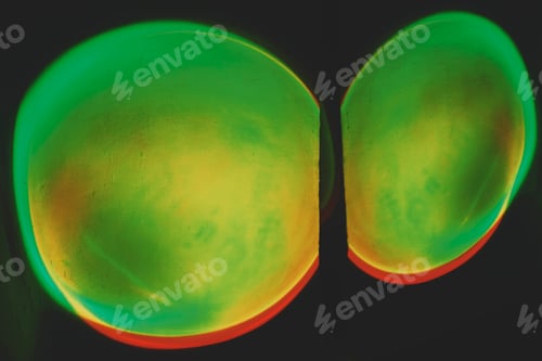 Preview: Abstract image of colorful shapes of light against black background
