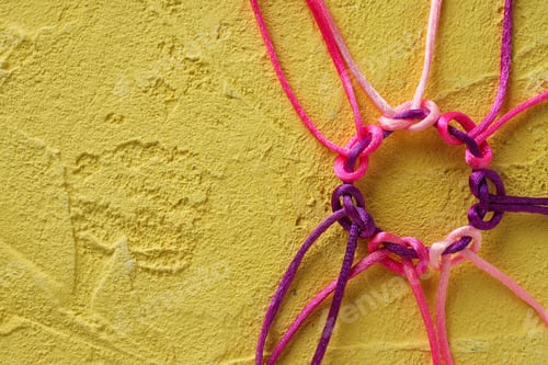 Pink and Purple Knot Circle on Yellow
