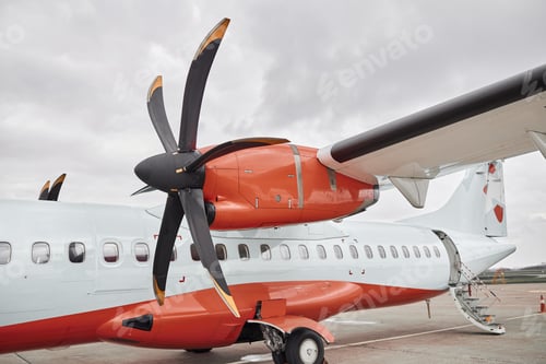 Preview: Propeller airplane on parking in airport