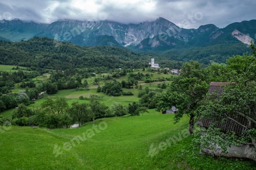 Preview: Drežnica village, Slovenia. Drone aerial view. Picturesque rural green landscape