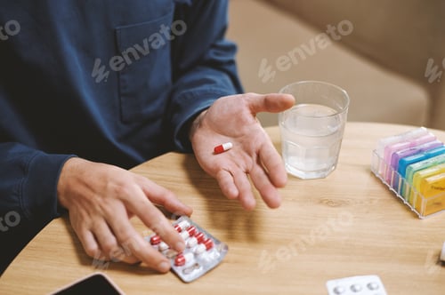 Preview: Person Taking Painkiller Pill