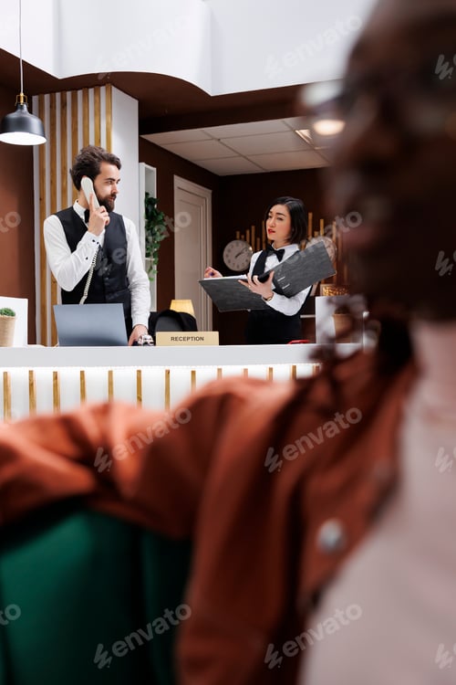 Preview: Hotel staff working on reservations