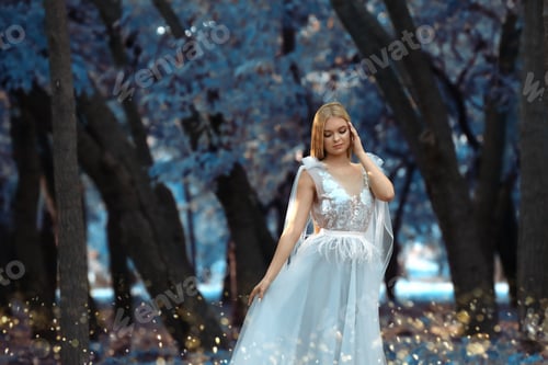 Preview: Beautiful girl wearing fairy dress in autumn forest