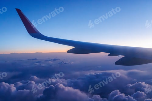 Preview: Sunset above the clouds from airplane