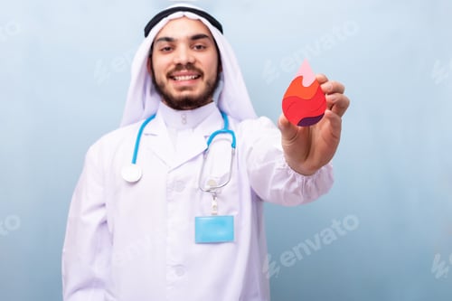 Preview: Blood drop transfusion. Arabic male doctor hold drop of blood.