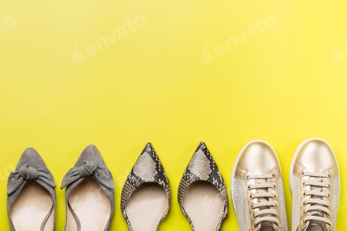Preview: Set of fashionable female shoes on yellow background