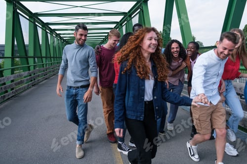 Preview: Group of young people walking together on a green bridge