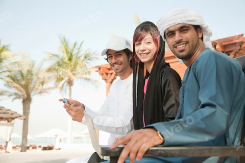 Preview: Three friends sharing a moment outdoors in warm weather