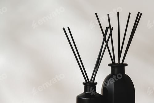 Preview: Minimalist Aromatic Reed Diffusers on a Wooden Surface Against a Soft Background