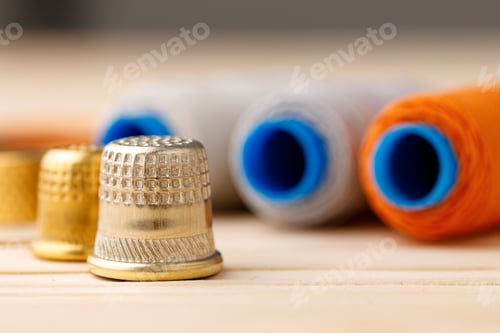 Preview: Threads and sewing accessories on wooden table