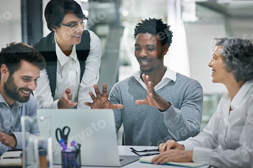 Preview: Cropped shot of a group of colleagues brainstorming together on a laptop in a modern office