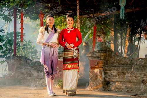 Preview: Portrait of two beautiful Asian woman stand in front of old or ancient architecture or building