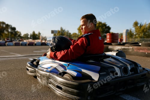 Preview: Back view shot of competitive racer driving go-cart sports track