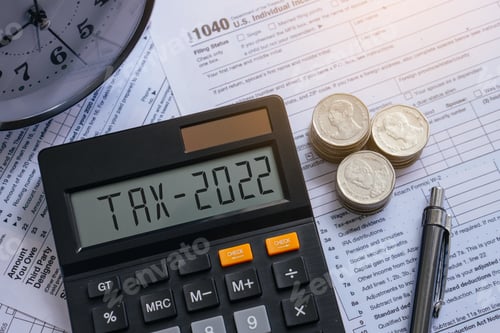 Preview: Tax word and 2022 number on calculator. Pay tax or vat in 2022 years. Business and tax concept.