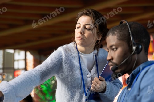 Preview: Close up of supervisor in customer support department office teaching intern