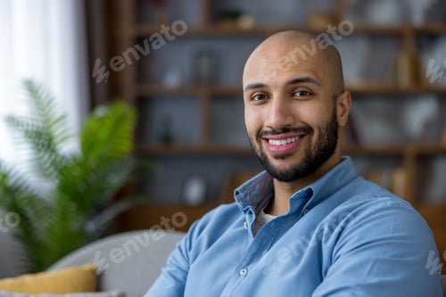Preview: Happy man smiling, feeling confident and relaxed at home