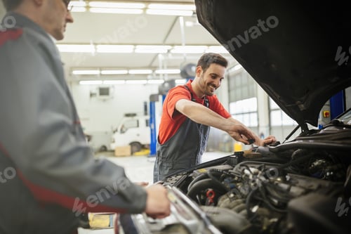 Preview: Car mechanics working and maintaining car
