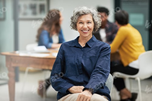 Preview: Smiling Woman Sits at Meeting with Coworkers