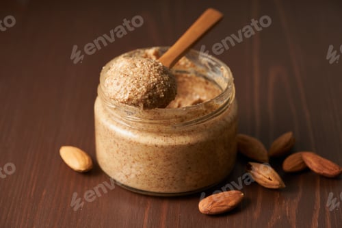 Preview: almond butter, raw food paste made from grinding almonds into nut butter, side view