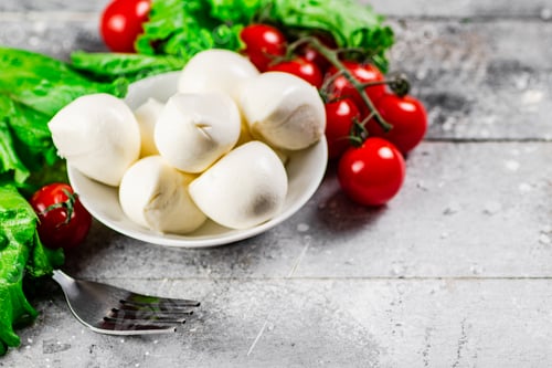 Preview: Mozzarella cheese with cherry tomatoes and herbs.