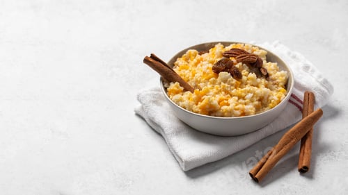 Preview: Rice millet porridge with pumpkin and cinnamon. Healthy breakfast. Copy space