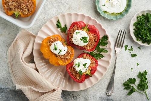 Preview: Roast stuffed red and yellow bell peppers with couscous, brown rice and spelled with Greek sauce and