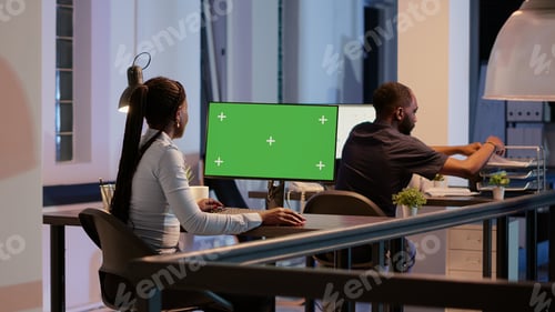 Preview: Business woman working with greenscreen on computer