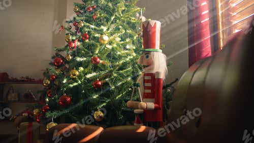 Preview: Nutcracker and Christmas tree over the Red Armchair
