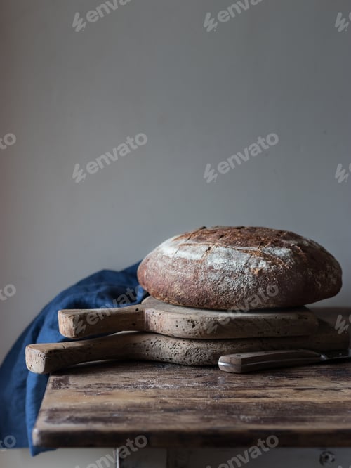 Preview: Oil and wholegrain bread on table