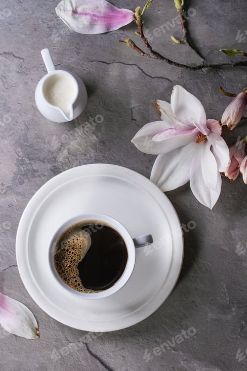 Preview: Cup of black coffee with magnolia