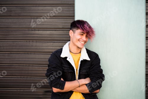 Preview: Smiling teenage boy with vibrant dyed purple hair standing outdoors