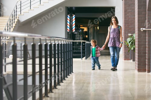 Preview: Mum and the son walking in the shopping center